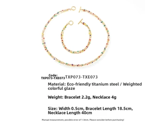 Detailed specs of colorful enamel beads on gold-plated titanium steel necklace and bracelet