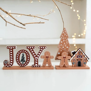 Christmas JOY wooden table ornament with gingerbread man and star lights on white background