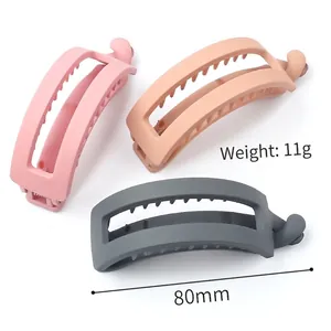 Matte banana hair clips in pink and grey showing 80mm length and 11g lightweight design