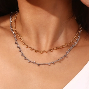 Minimalist 18K gold and silver plated stainless steel necklaces with bead fringe details