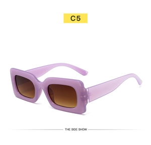Detail view of retro square purple translucent sunglasses with brown gradient lenses