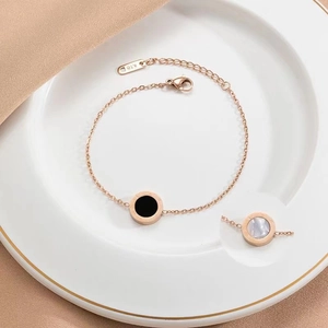 Elegant 18K rose gold stainless steel bracelet with black and white Roman numeral pendants
