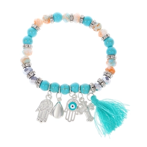 Kleurrijke kralenarmband met turquoise, kruis, boze oog en kwastjes hangers