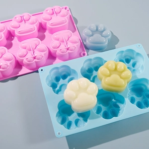Detail of 6-cavity cat paw silicone mold showing flexible texture and easy release results