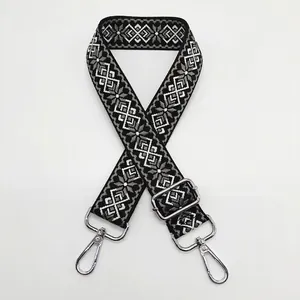 Detail of 3.8cm jacquard canvas bag strap with black and grey geometric diamond patterns