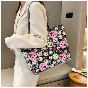 Casual canvas tote bag with pink smiley and heart prints on a lifestyle model shot