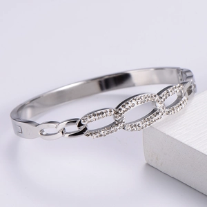 Detailed view of silver geometric cuff bracelet with sparkling zircon accents on stone