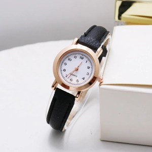 Minimalist vintage quartz watch with black leather strap and rose gold Arabic dial