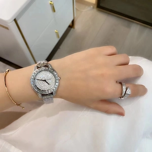 Luxury silver quartz watch with full diamond dial and matching snake shaped ring for women