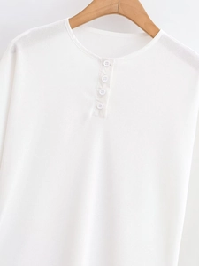 Detail of white Henley neck top showing breathable mesh texture and four buttons on hanger