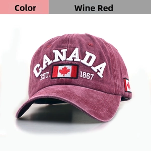 Detailed embroidery of CANADA EST. 1867 and flag on burgundy cotton baseball cap