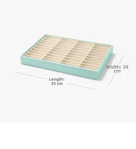 Macro view of mint green 40-grid jewelry tray for bracelet storage, 35x24 cm detail