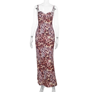 Detailed close-up of brown leopard print pattern and thin straps on the bodycon maxi dress