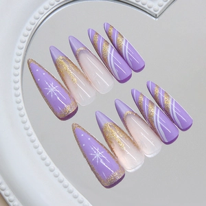 Dreamy purple cat-eye press on nails with delicate glitter snowflakes and stiletto shape