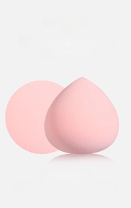 Macro shot of pink teardrop beauty blender showing high density fine pores and soft texture