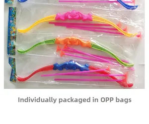 Macro view of children's plastic archery set with colorful bows and suction cup arrows