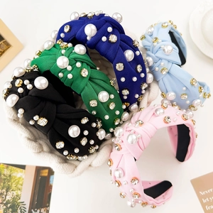 Detail of wide knotted headbands with pearls and rhinestones in multiple colors