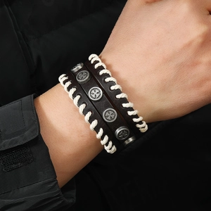 Vintage brown leather wristband for men with cross rivets and white rope weave details
