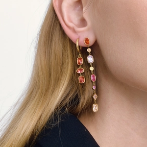 Classic geometric tassel earrings with colorful zircons worn by a female model