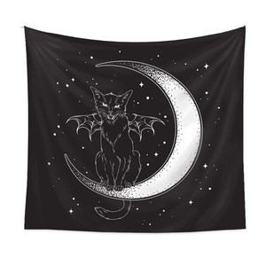 Close-up of a winged black cat on a crescent moon tapestry with star details