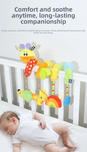 Colorful giraffe plush activity spiral toy wrapped on crib rail with sleeping baby
