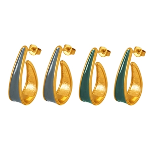 Golden geometric stud earrings set with gray and green enamel finish on white background