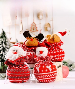 Set of 4 festive knitted Christmas gift bags featuring plush Santa, reindeer, bear, and snowman