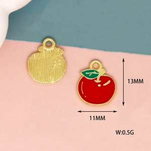Detail view of 13mm apple alloy pendants with red enamel and golden textured back