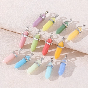 Detailed view of twelve multicolored hexagonal crystal pendants with silver metal clasps