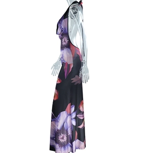 Side view of backless maxi dress with purple floral print and halter neck design