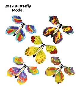 Detail of five colorful rubber band powered flying butterfly toys with vibrant patterns