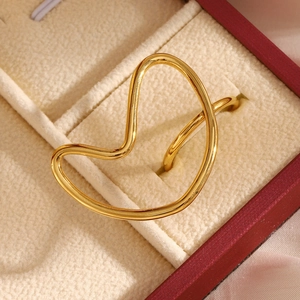 Detailed close-up of a 18K gold-plated irregular wavy ring in a velvet jewelry box