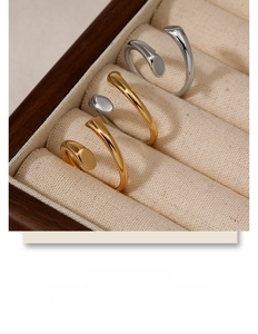 Exquisite detail of gold and silver minimalist open rings displayed in a luxury box