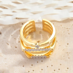 Detail of gold-plated multi-layer open ring with sparkling pavé cubic zirconia