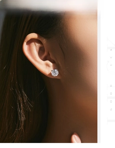 Macro close-up of a brilliant rose cut diamond stud earring set in six-prong silver