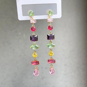 Elegant gold drop earrings with colorful teardrop stones and long crystal tassels