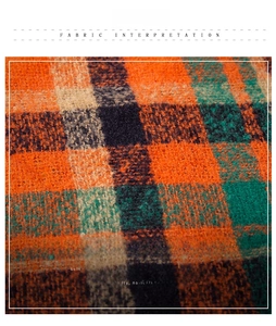 Close-up of soft plaid fabric in orange and navy with high-quality anti-shedding texture