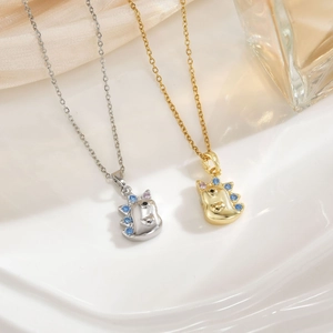 Matching gold and silver unicorn necklaces with micro-paved blue and pink zircon crystals