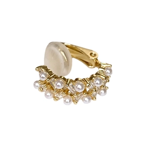 Elegant multi-layer gold ear cuff with white pearls and square zircons on white background