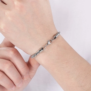 Men's 18k twisted rope stainless steel chain bracelet on wrist minimalist style