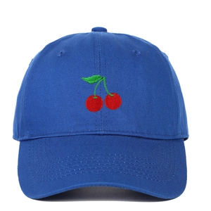 Detailed close-up of red cherry embroidery on a classic navy blue cotton baseball cap