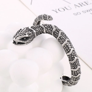 Macro view of vintage snake cuff bracelet with detailed scales and oxidized silver finish