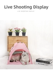 Cozy pink foldable pet tent with breathable mesh vents and grey cat resting inside