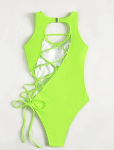 Detail of neon green one-piece swimsuit with lace-up side ties and metal back clasp