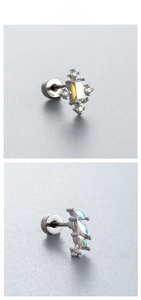 Detail of surgical steel barbell studs with iridescent AB stones and marquise crystals