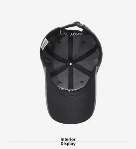 Interior view of vintage black cotton baseball cap showing seams and brass metal buckle