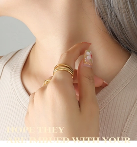 Close-up of elegant 18k gold plated U-shape ring set with zircon accents on a model