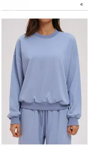 Detail of grey blue crewneck sweatshirt set with ribbed cuffs and drop shoulder fit
