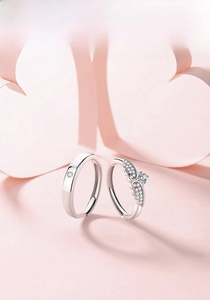 Detailed macro view of adjustable angel wing couple rings set in polished S925 silver