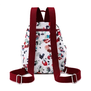 Women's floral nylon backpack in white with colorful prints and burgundy straps
